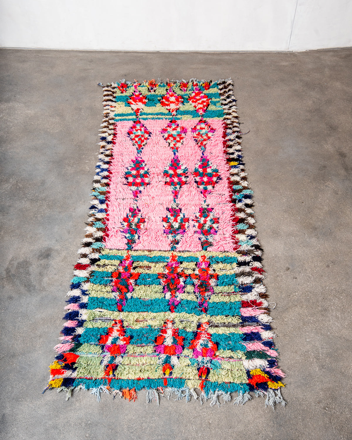 Modern designer vintage handcrafted Berber rug from Morocco. Boucherouite runner rug with beautiful colors and patterns.